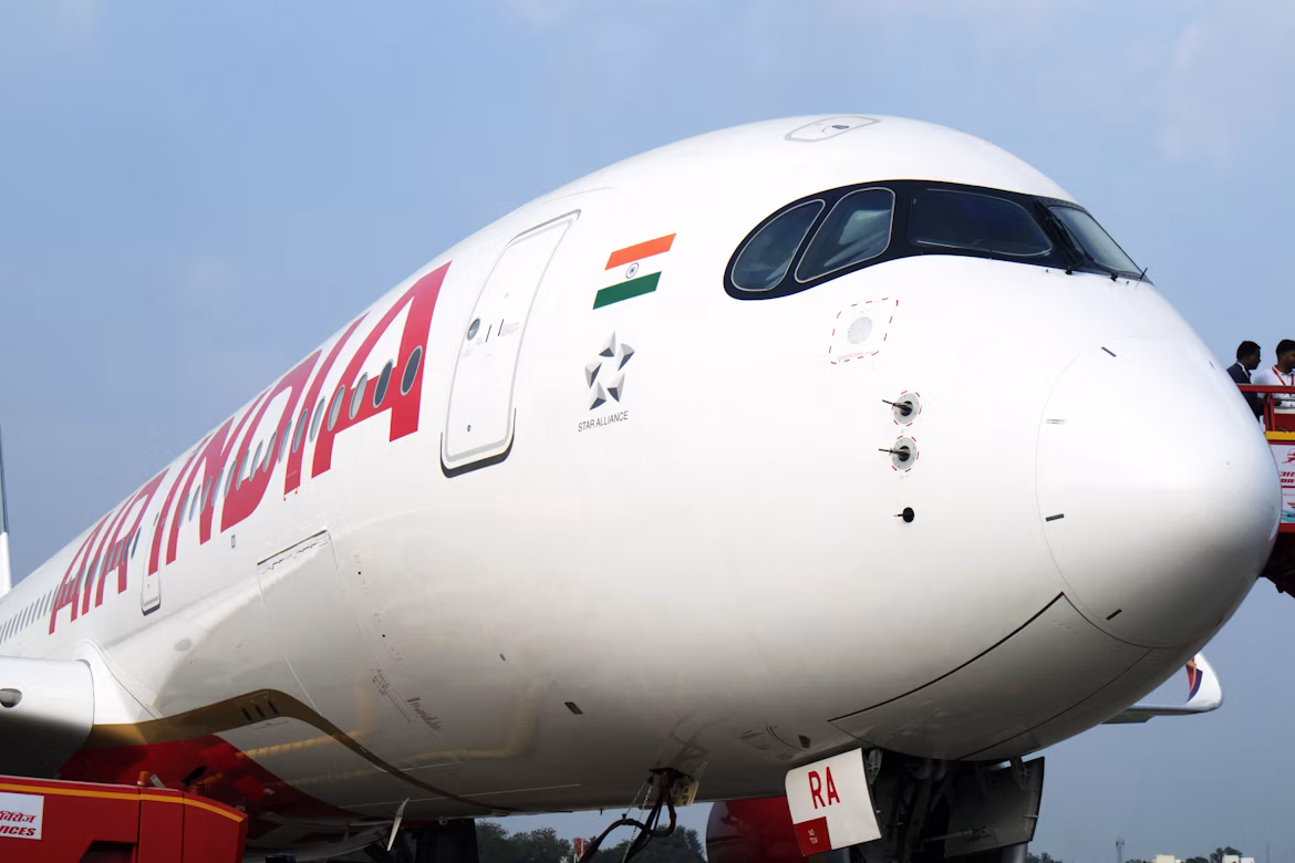 A close up shot of an Air India aircraft, focused on the cockpit and front end of the plane.