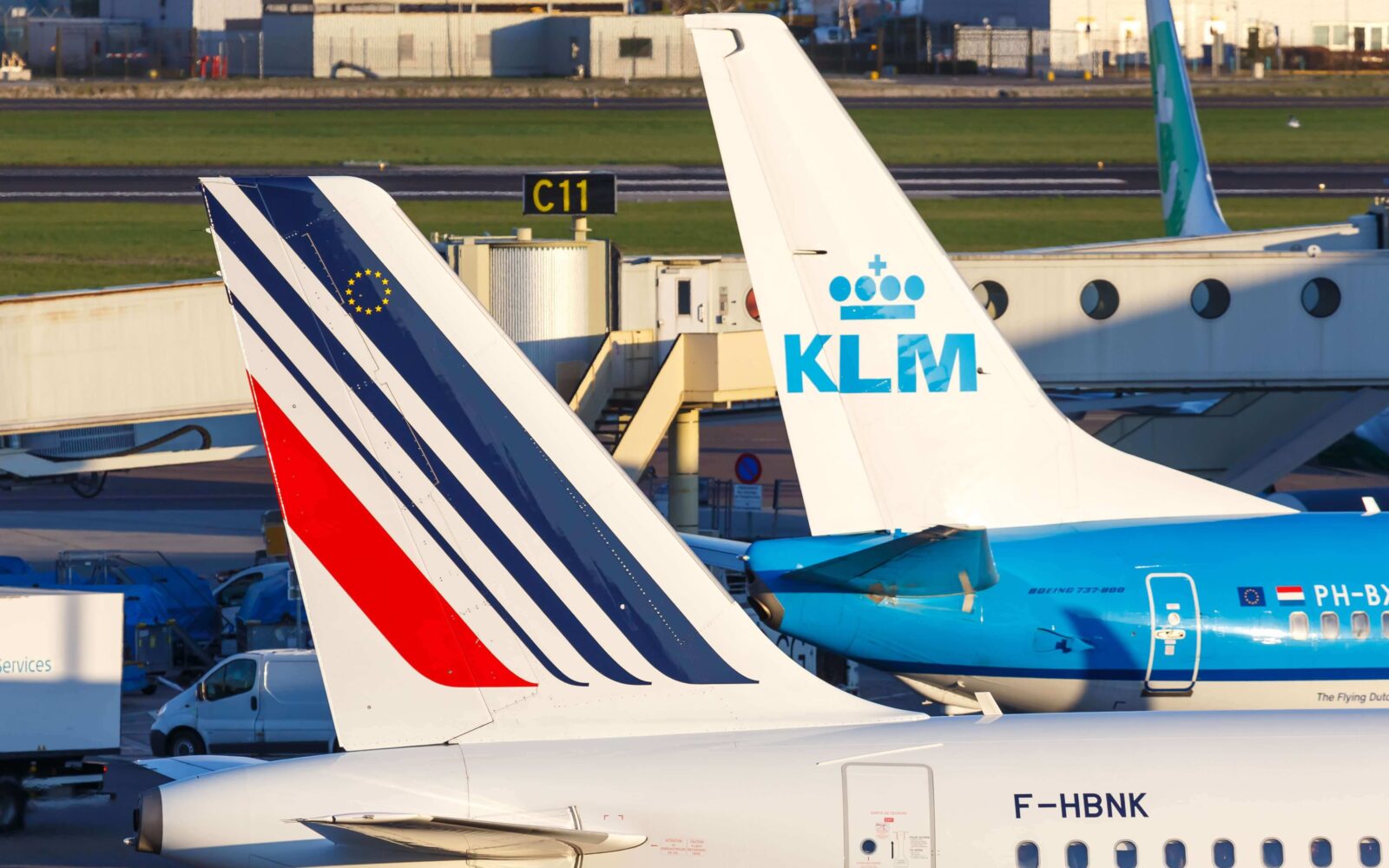 The tails of KLM and Air France aircraft stationed at an airport