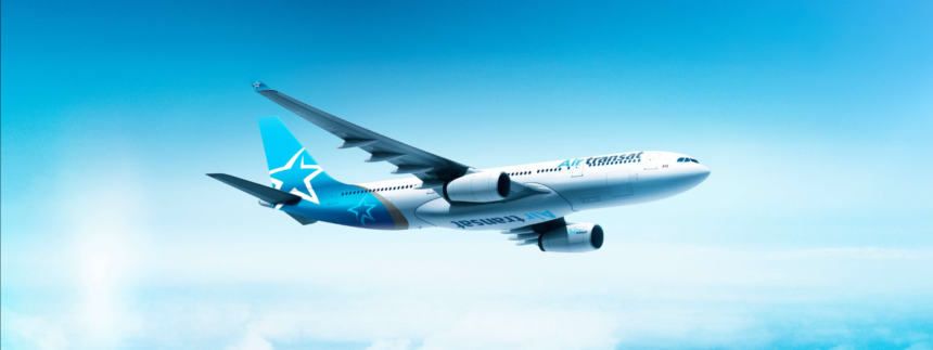 Image shows Air Transat aircraft flying in a light blue sky