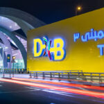 Photograph depicting DXB Terminal 3 sign in both Arabic and English.