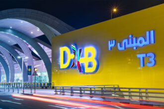 Photograph depicting DXB Terminal 3 sign in both Arabic and English.
