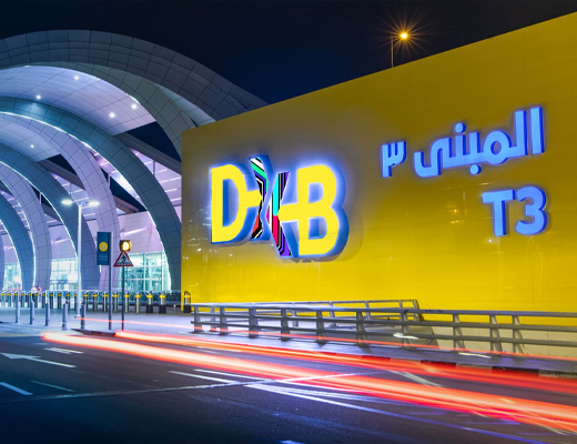 Photograph depicting DXB Terminal 3 sign in both Arabic and English.