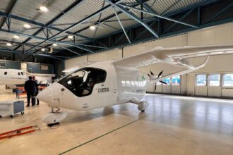 A Beta Technologies aircraft on the ground indoors.