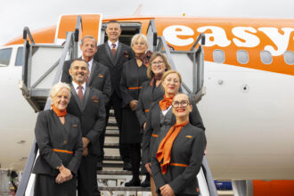 Image show eight easyJet cabin crew on the boarding steps to an easyJet aircraft