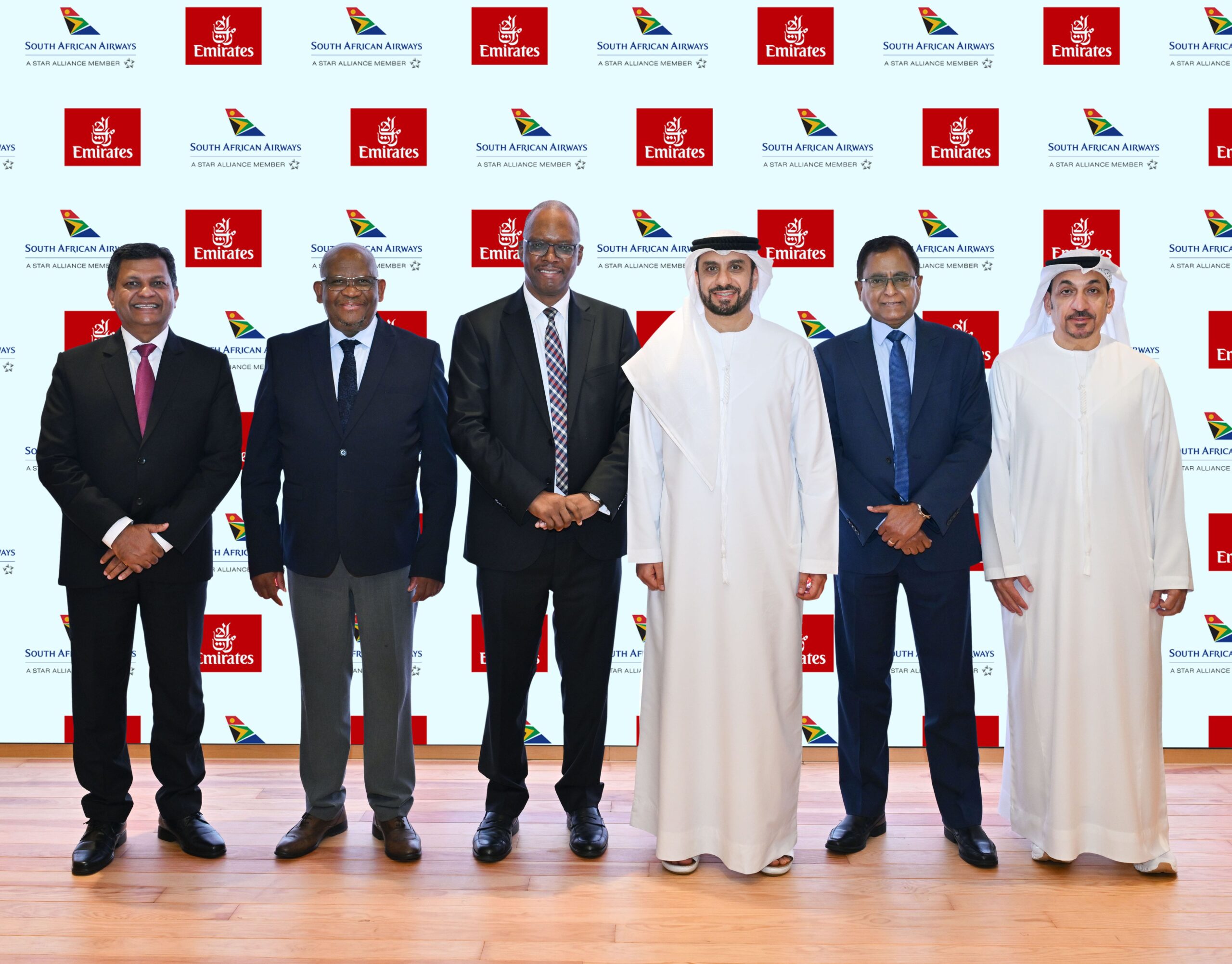 Photograph depicting representatives from Emirates and South African Airways meeting the press and reporters.
