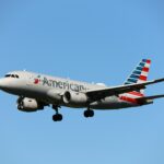 American Airlines mid-flight with blue sky in the backgrouund