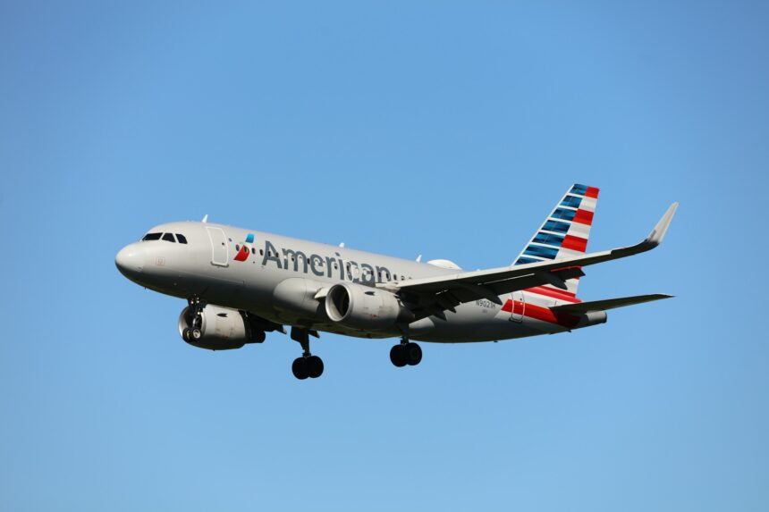 American Airlines mid-flight with blue sky in the backgrouund