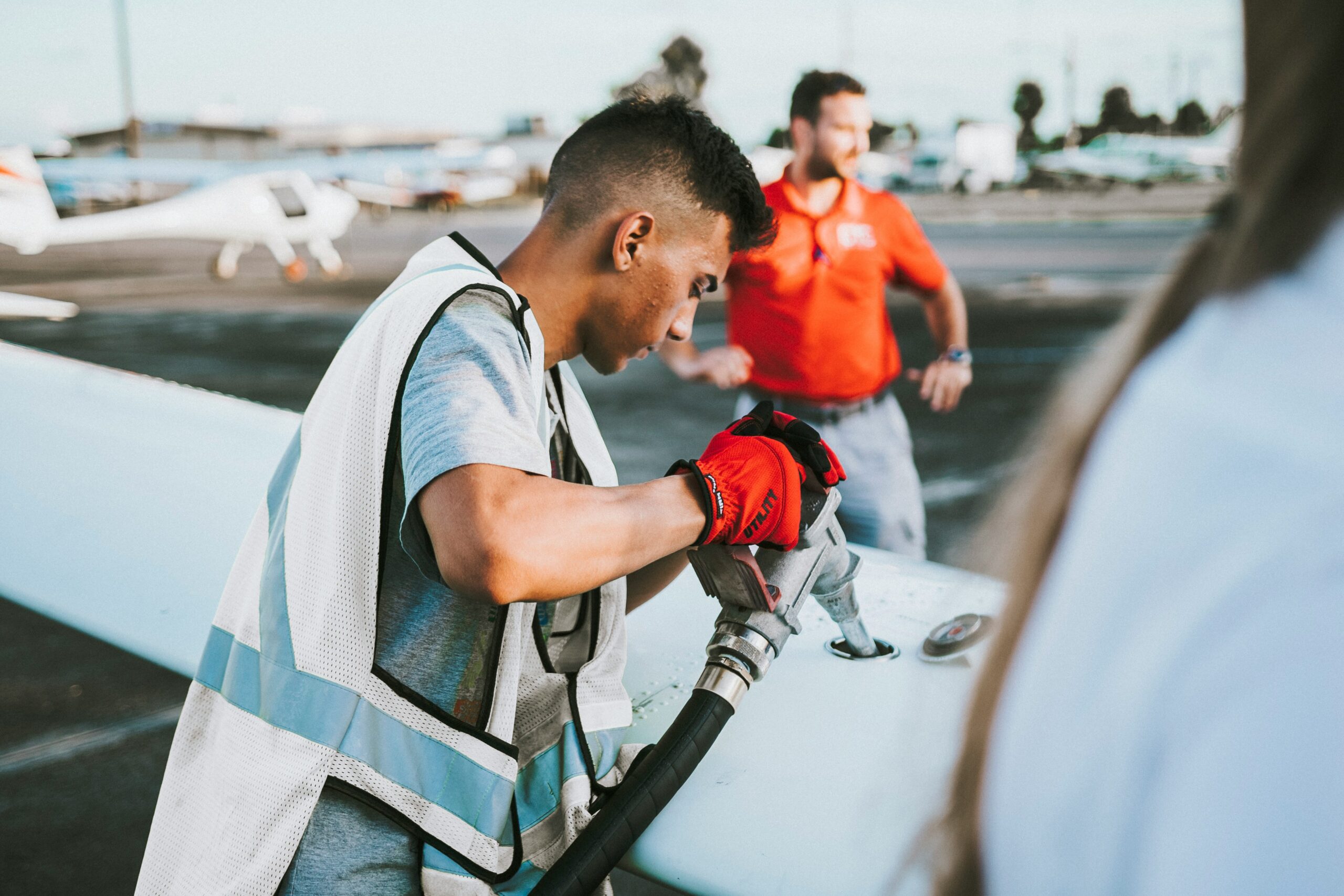 A man fuelling an aircraft