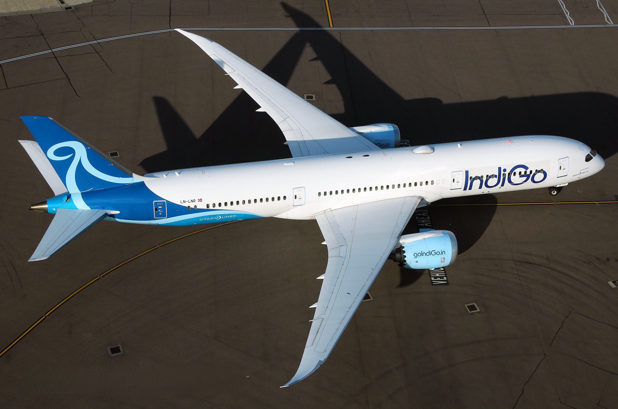 IndiGo-liveried Boeing 787-9 Dreamliner, registration LN-LNR, seen from above on the tarmac