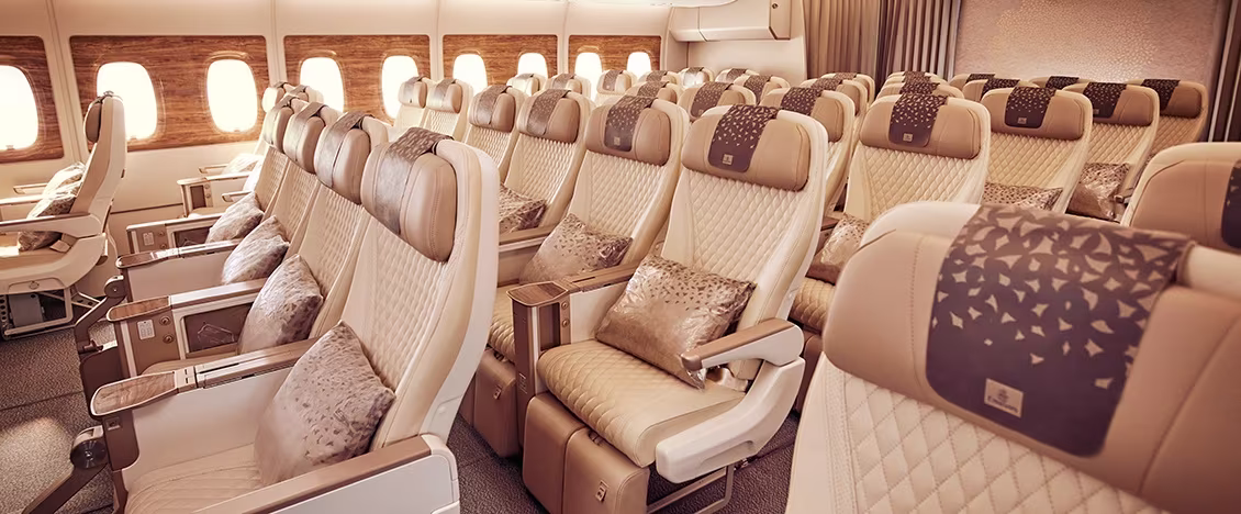 Photograph depicting rows of comfortable leather chairs in Emirates Premium Economy class on the Boeing 777.