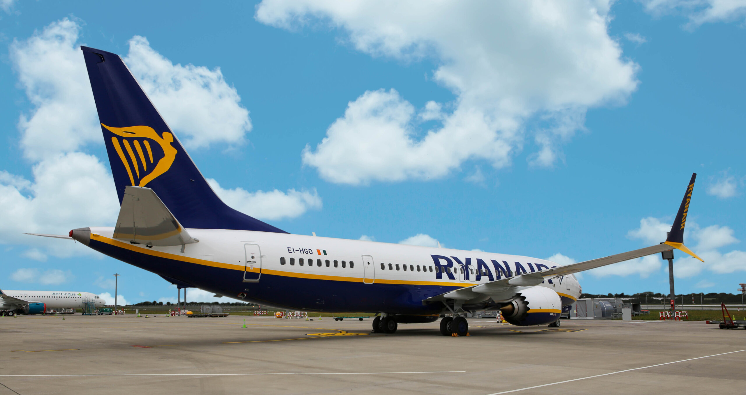 An image of an Ryanair aircraft taken from behind the aircraft as it turns on a runway. 