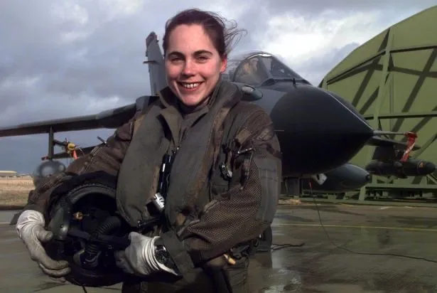Jo Salter standing in front of an aircraft wearing gear.