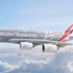 Photograph depicting Emirates Skywards livery on Airbus A380 flying above the clouds.
