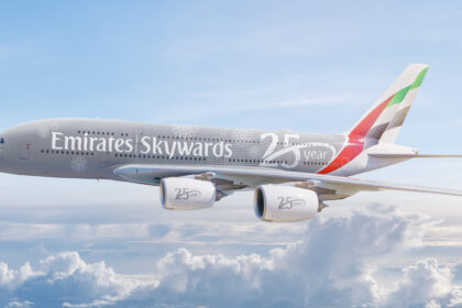 Photograph depicting Emirates Skywards livery on Airbus A380 flying above the clouds.