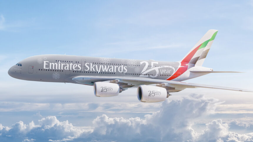 Photograph depicting Emirates Skywards livery on Airbus A380 flying above the clouds.