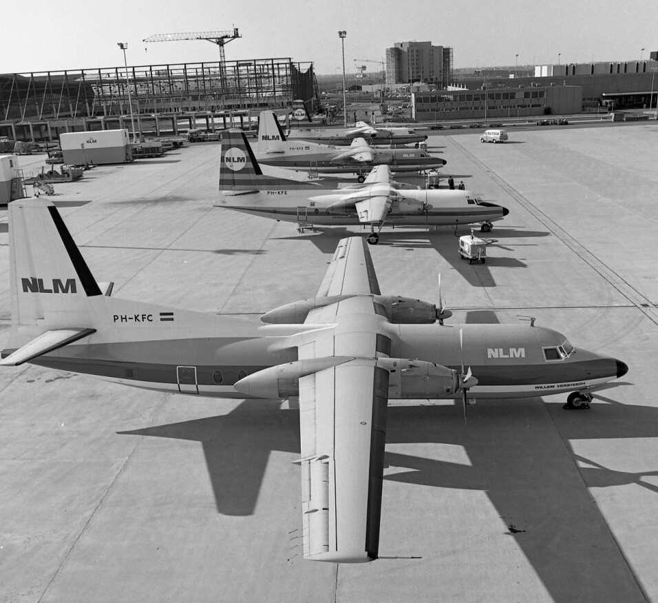 A black-and-white photograph depicting an NLM (precursor to KLM) aircraft on the runway in 1966.