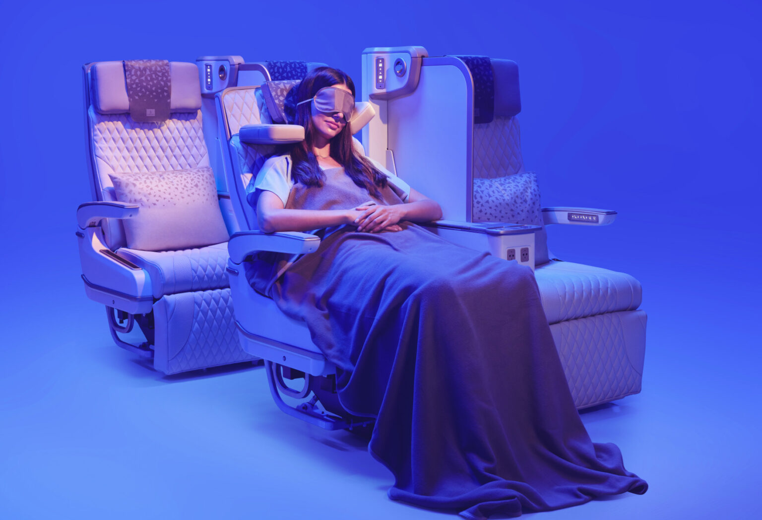 The photograph shows a customer relaxing in Emirates’ new Premium Economy seat, featuring the globally acclaimed U-Dream headrest for enhanced neck and head support