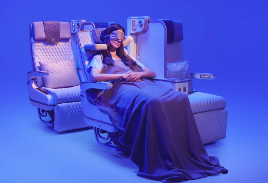 The photograph shows a customer relaxing in Emirates’ new Premium Economy seat, featuring the globally acclaimed U-Dream headrest for enhanced neck and head support