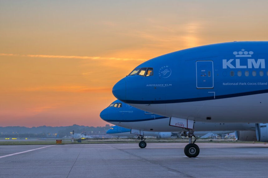 Photograph depicting the front of KLM aircraft including the cockpit and wheels on the runway.
