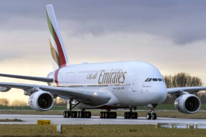 Photograph depicting an Emirates Airbus A380 on the runway of an airport.
