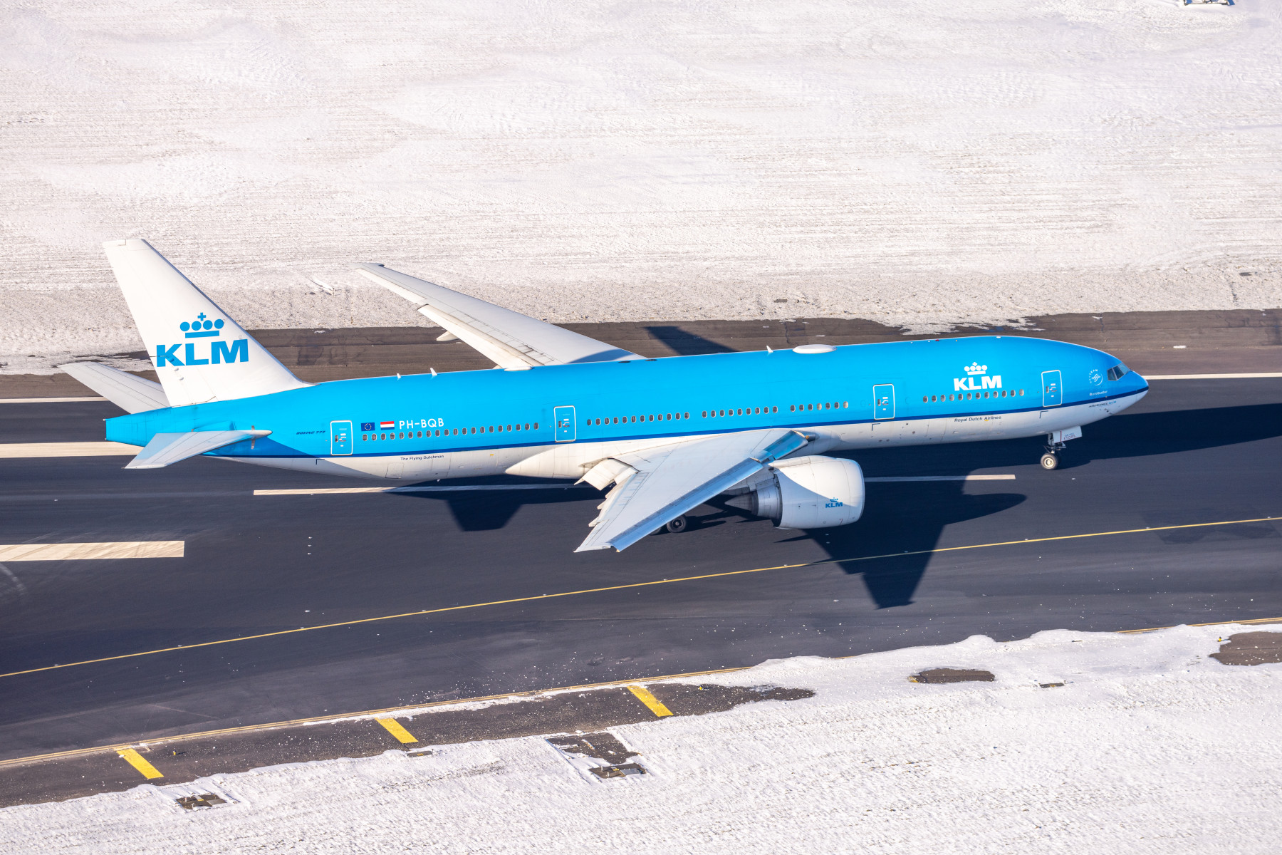 Photograph depicting KLM aircraft on the runway which is surrounded by snow, thus representing KLM's winter network.