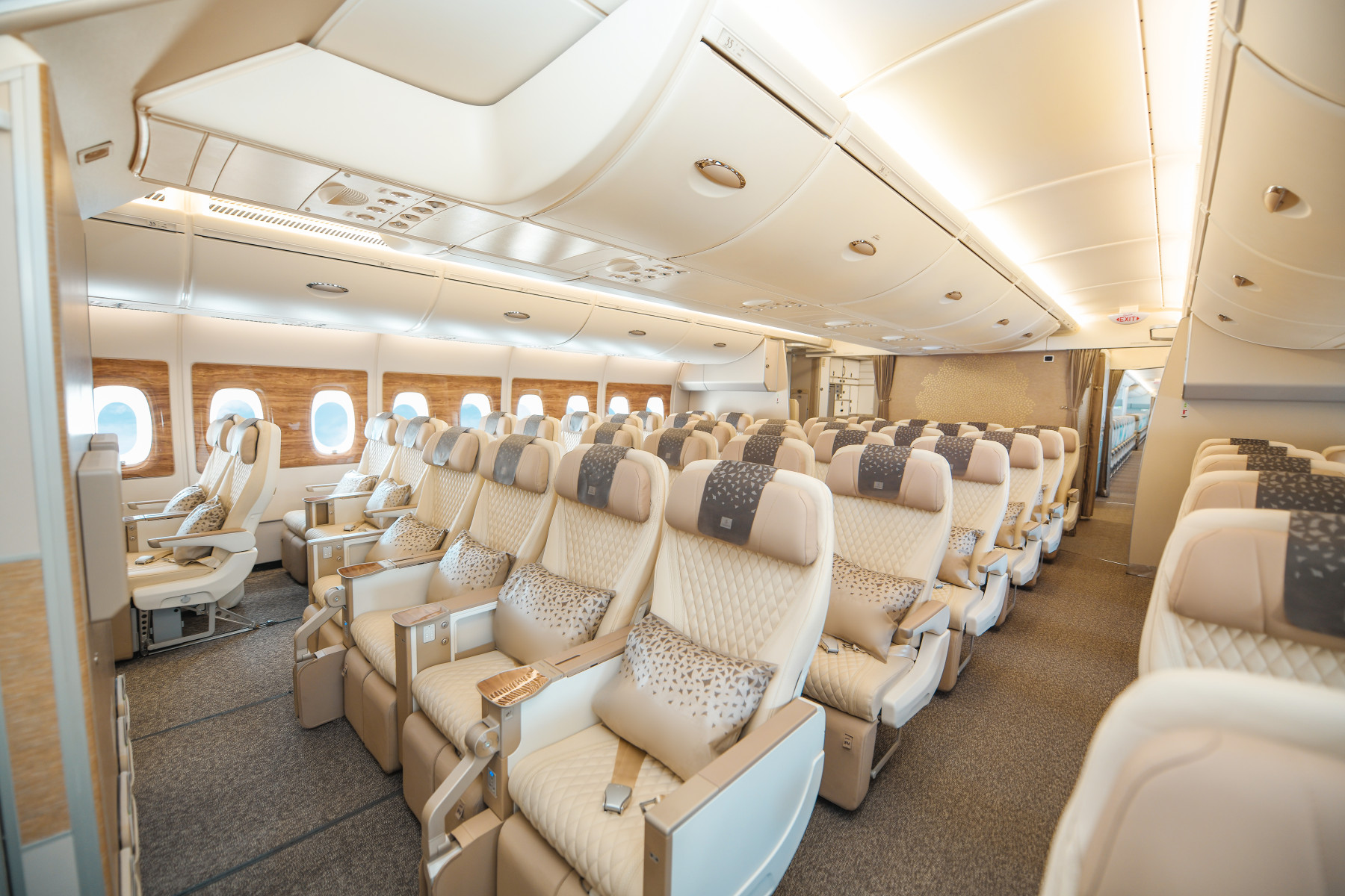 Photograph depicting the interiors of the Premium Economy class cabin onboard the Emirates Airbus A350.