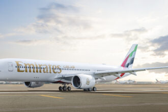 Photograph depicting the exterior of the Emirates Airbus A350 on the runway.
