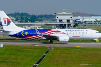 Full body of Malaysia Airlines Boeing 737-8 MAX on the ground.