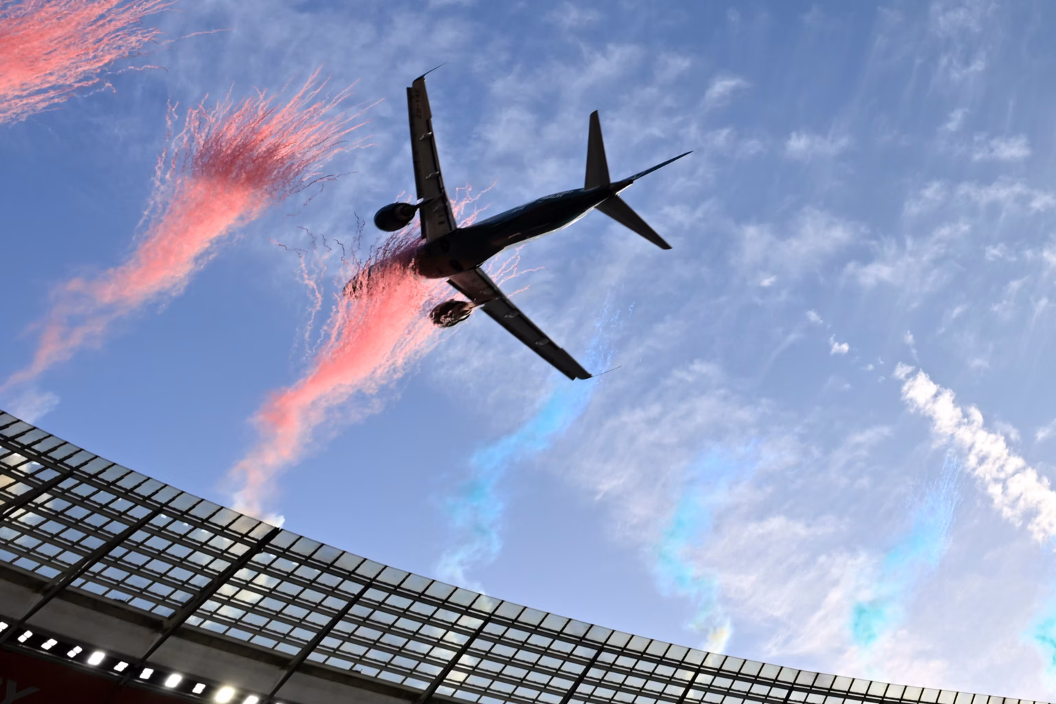 One of the Embraer-190 jets flying over DHL Stadium into a cloud of pink dust on Saturday August 29, 2026.