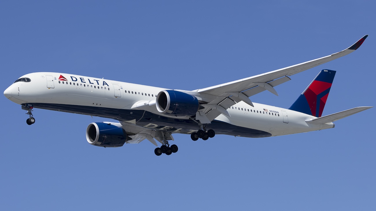 Delta Air Lines' Airbus A350-941 in the sky with its landing gear extended.