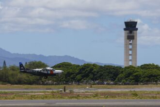 A Joby Aviation Cessna 208B Grand Caravan landing at Joint Base Pearl Harbor-Hickam