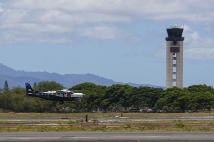 A Joby Aviation Cessna 208B Grand Caravan landing at Joint Base Pearl Harbor-Hickam