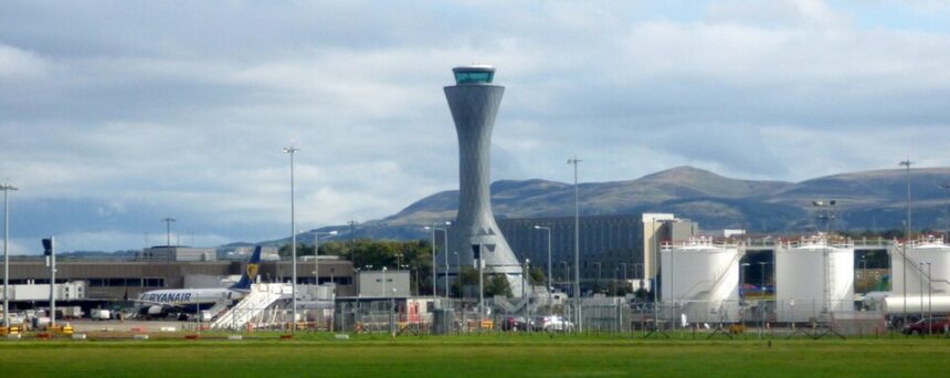 Airside at Edinburgh Airport with buildings and other airport infrastructure in the background.
