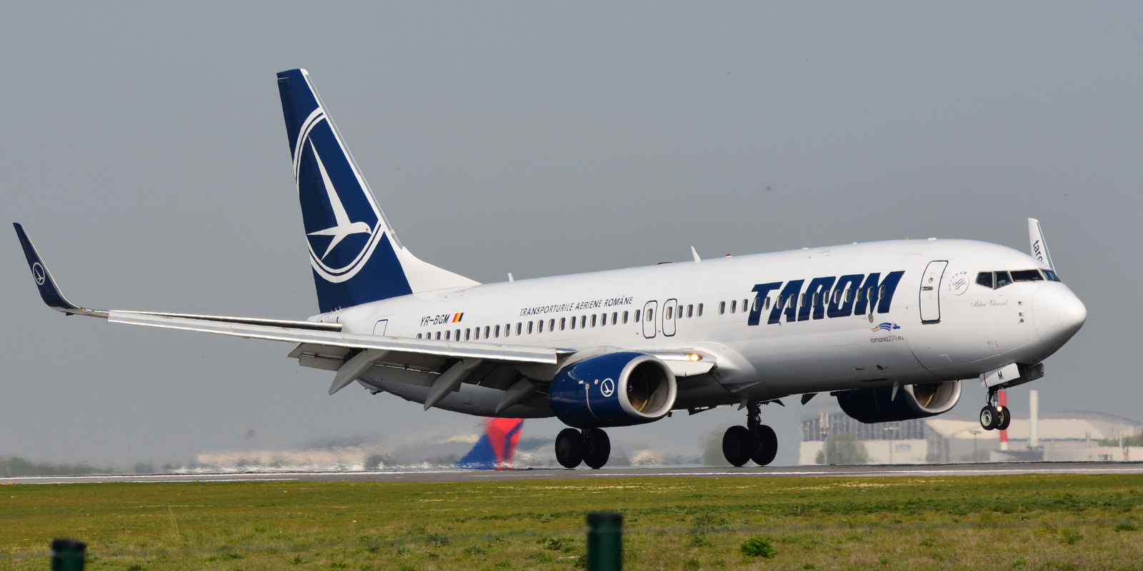 A TAROM Boeing 737-800 aircraft shown on a runway 