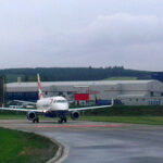 Image shows a British Airways aircraft awaiting its take-off slot at Aberdeen Airport in 2013 on a cloudy day