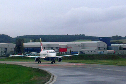 Image shows a British Airways aircraft awaiting its take-off slot at Aberdeen Airport in 2013 on a cloudy day