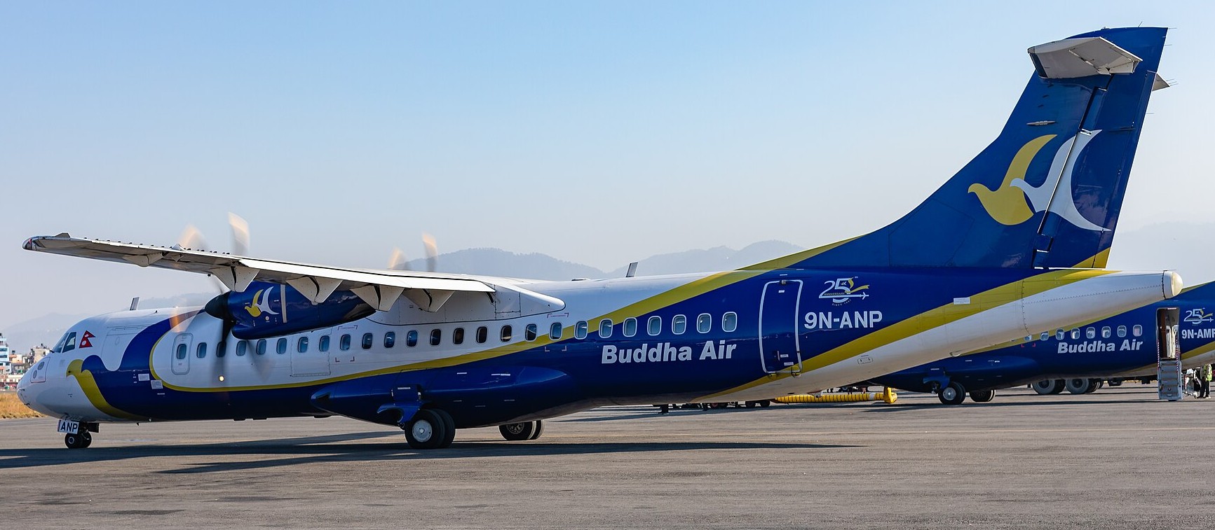 Buddha Air aircraft parked at taxiway