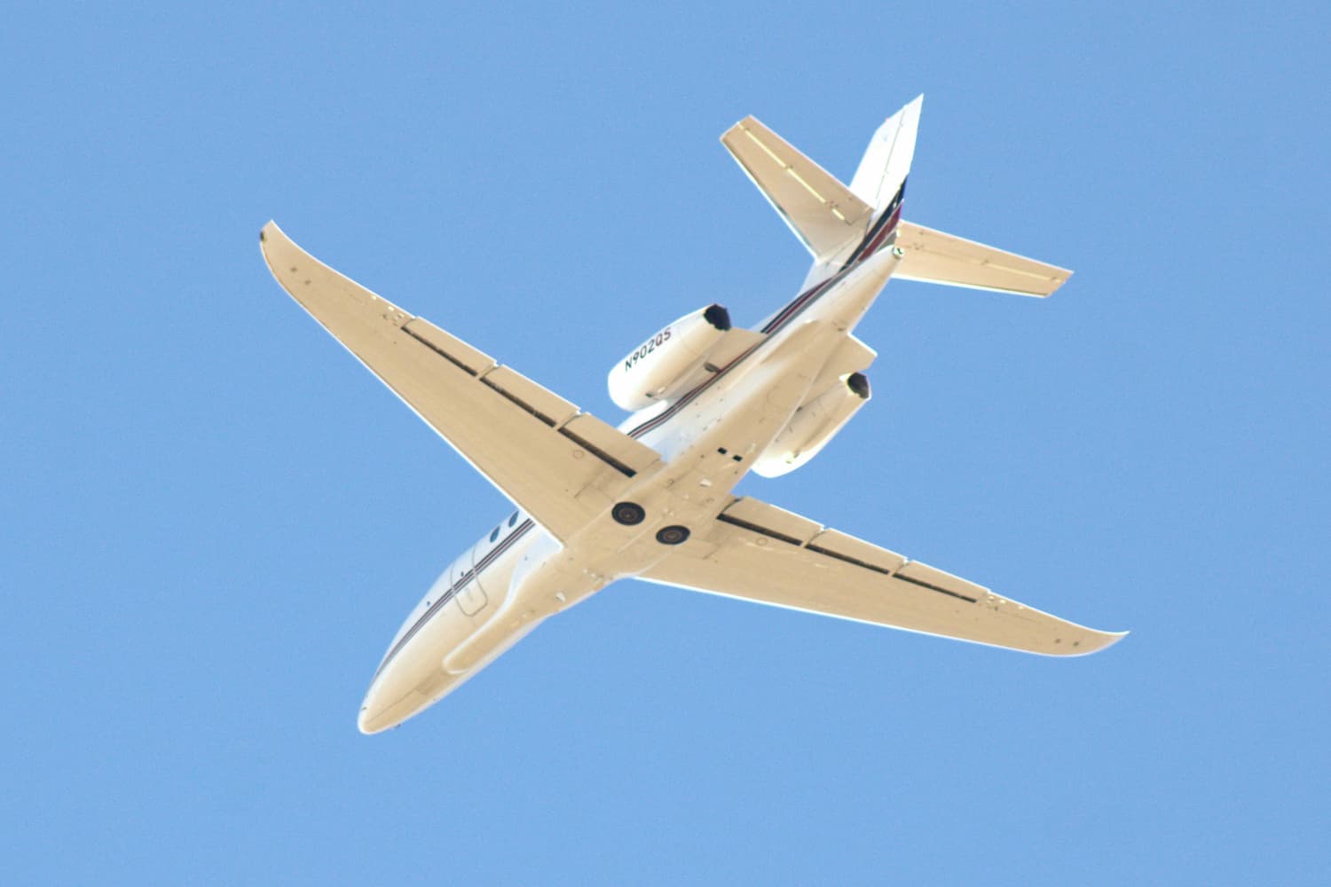 A Cessna Citation Latitude flying overhead