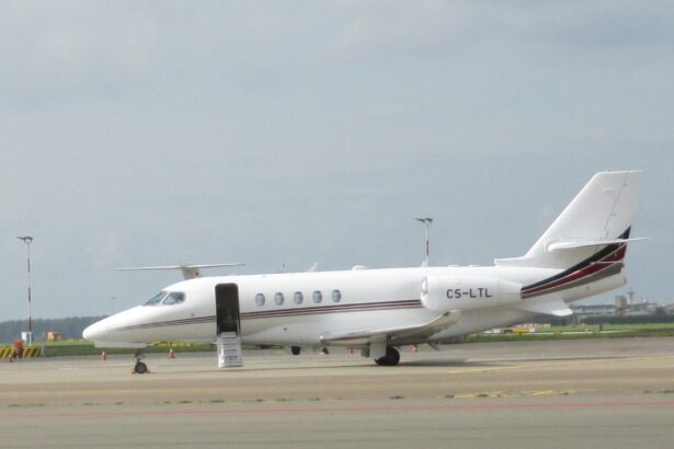 A Cessna Citation Latitude sitting on a runway, pictured from the side