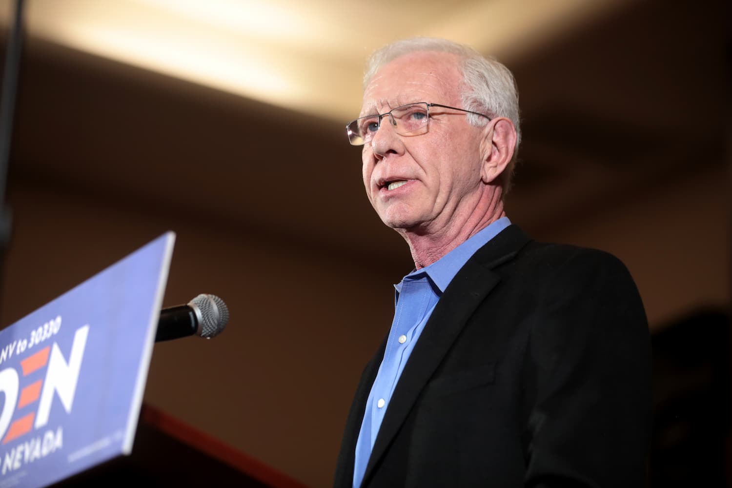 Image shows Sully Sullenberger speaking at a Joe Biden conference