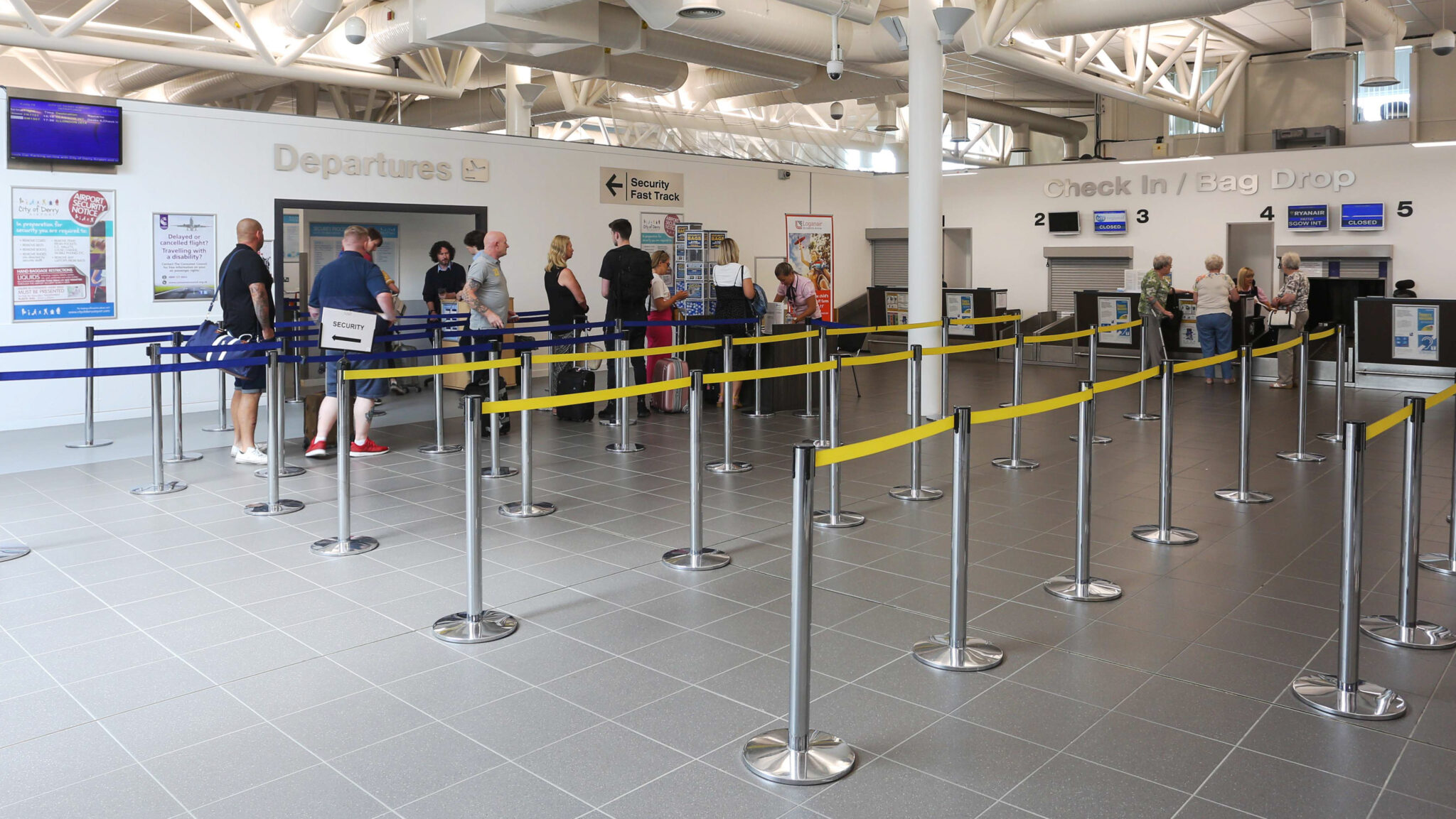 An image of passengers queueing to enter the departures are at City of Derry Airport (LDY).
