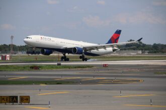 Delta Air Lines Airbus A330-300 descending with its landing gear extended