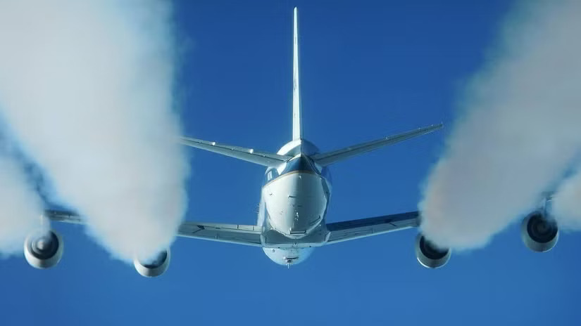 Photograph depicting Douglas DC 8 producing contrails from engines at biofuels tests.