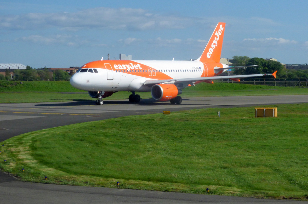 Image shows an Easyjet plane taxiing on the runway
