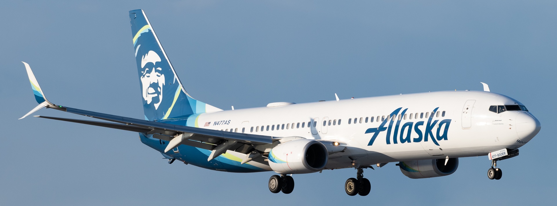 Alaska Airlines' Boeing 737-990ER in the air with its landing gear extended.