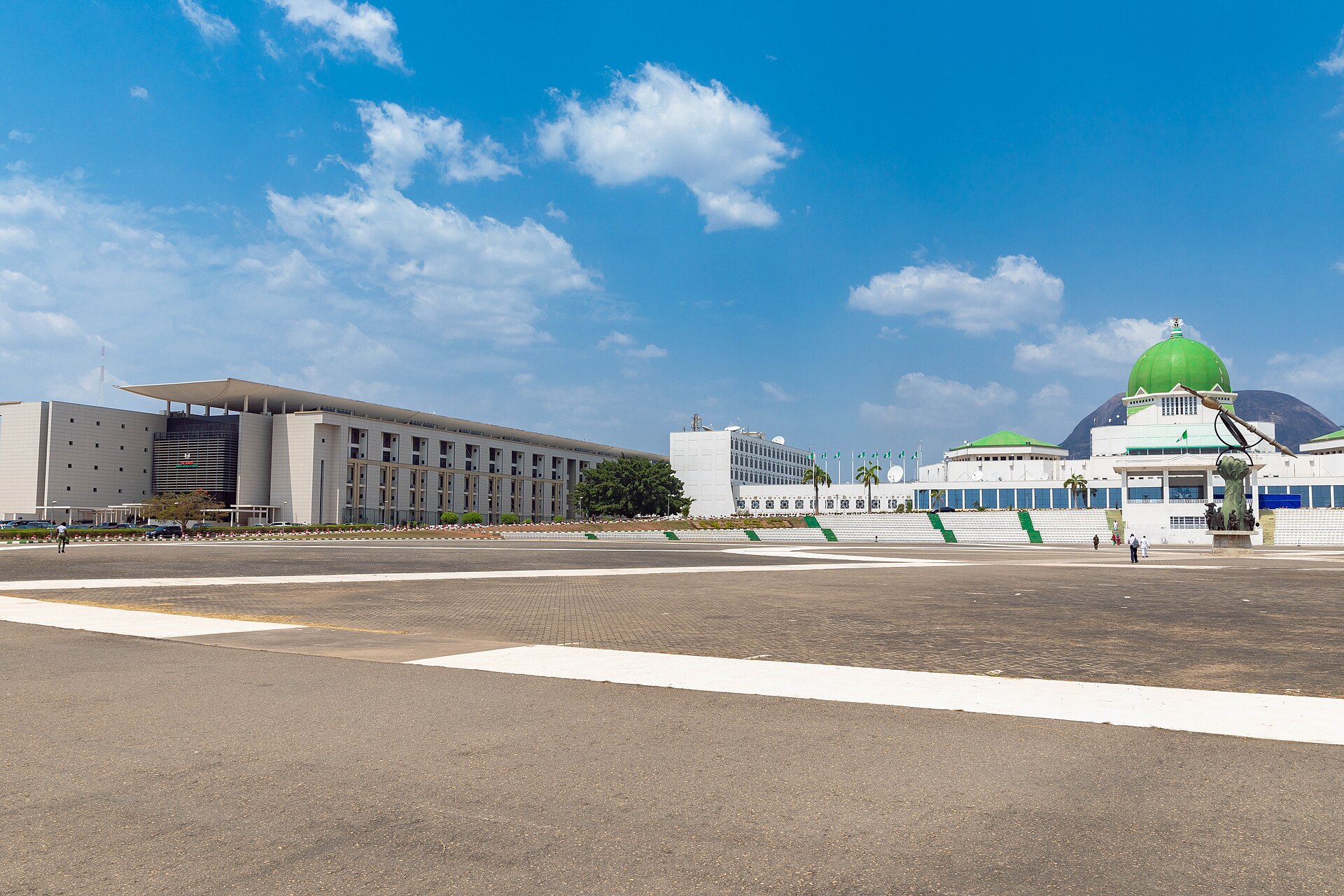 The Nigerian senate building in Abuja. The building is shown on a clear day, under a blue sky with few clouds.
