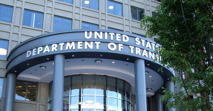The headquarters of the U.S. Department of Transportation in Washington. The department’s name is written in gold letters, in front of grey stone.