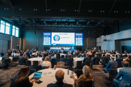 A room of people day at tables in front of a projector. The image is from the Aviation Connect Air Cargo Handling and Logistics Conference in Athens.