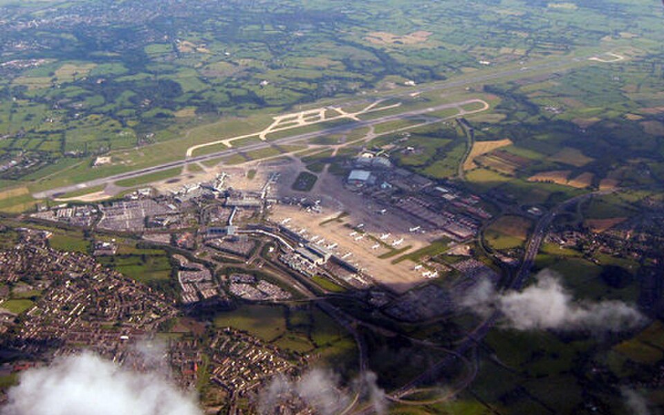 Bright aerial view of Manchester Airport from a plane.