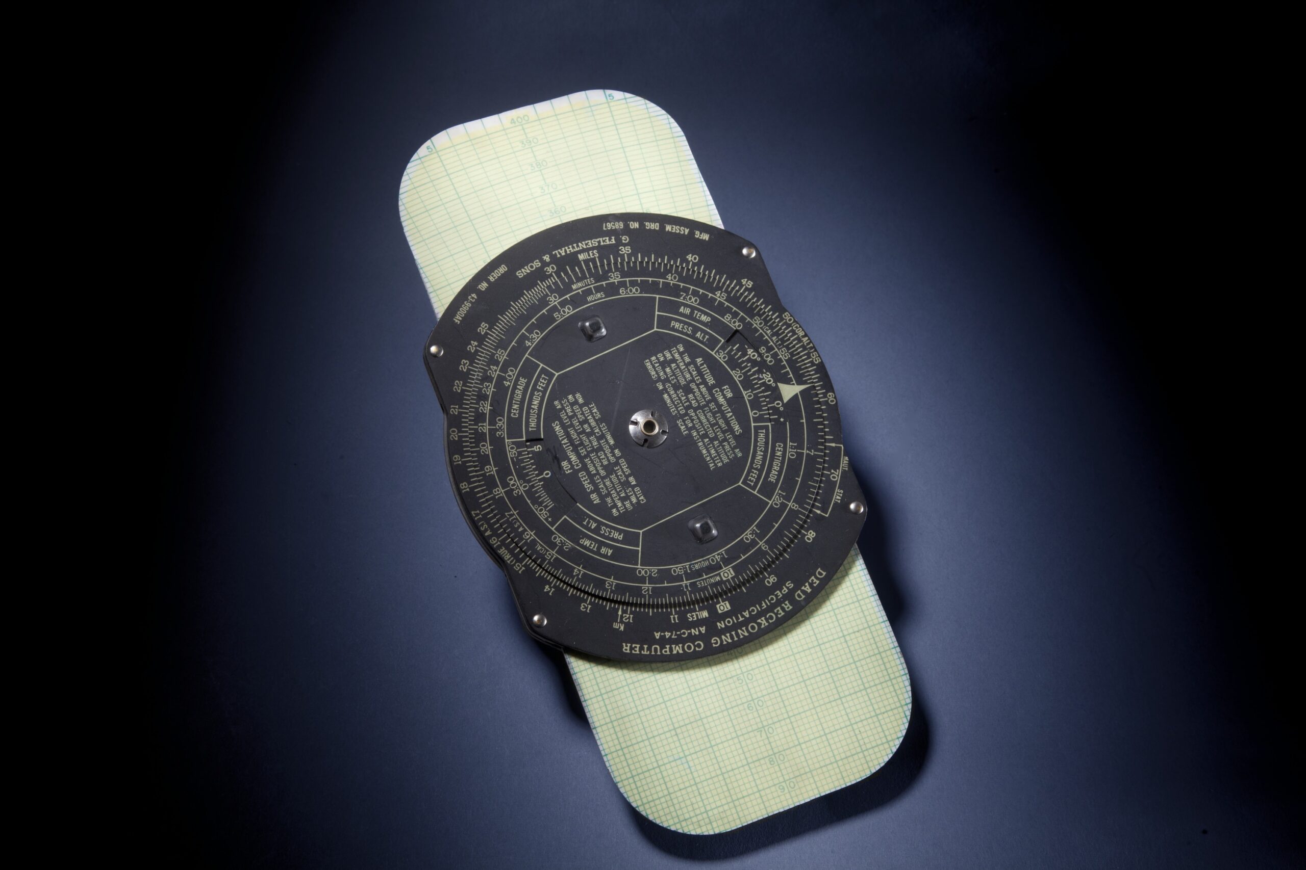 The Dead Reckoning navigation tool with yellow and green radials and a black plastic computer 